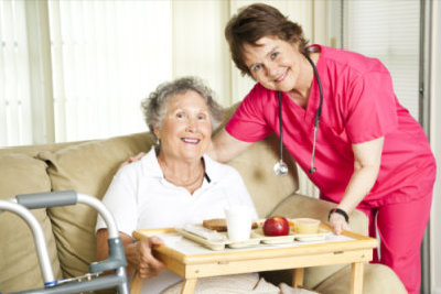 nurse giving patient her food